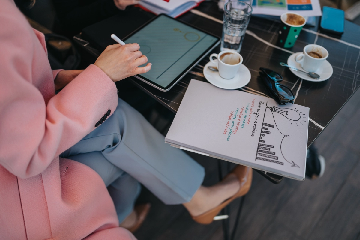 Woman taking notes at a table